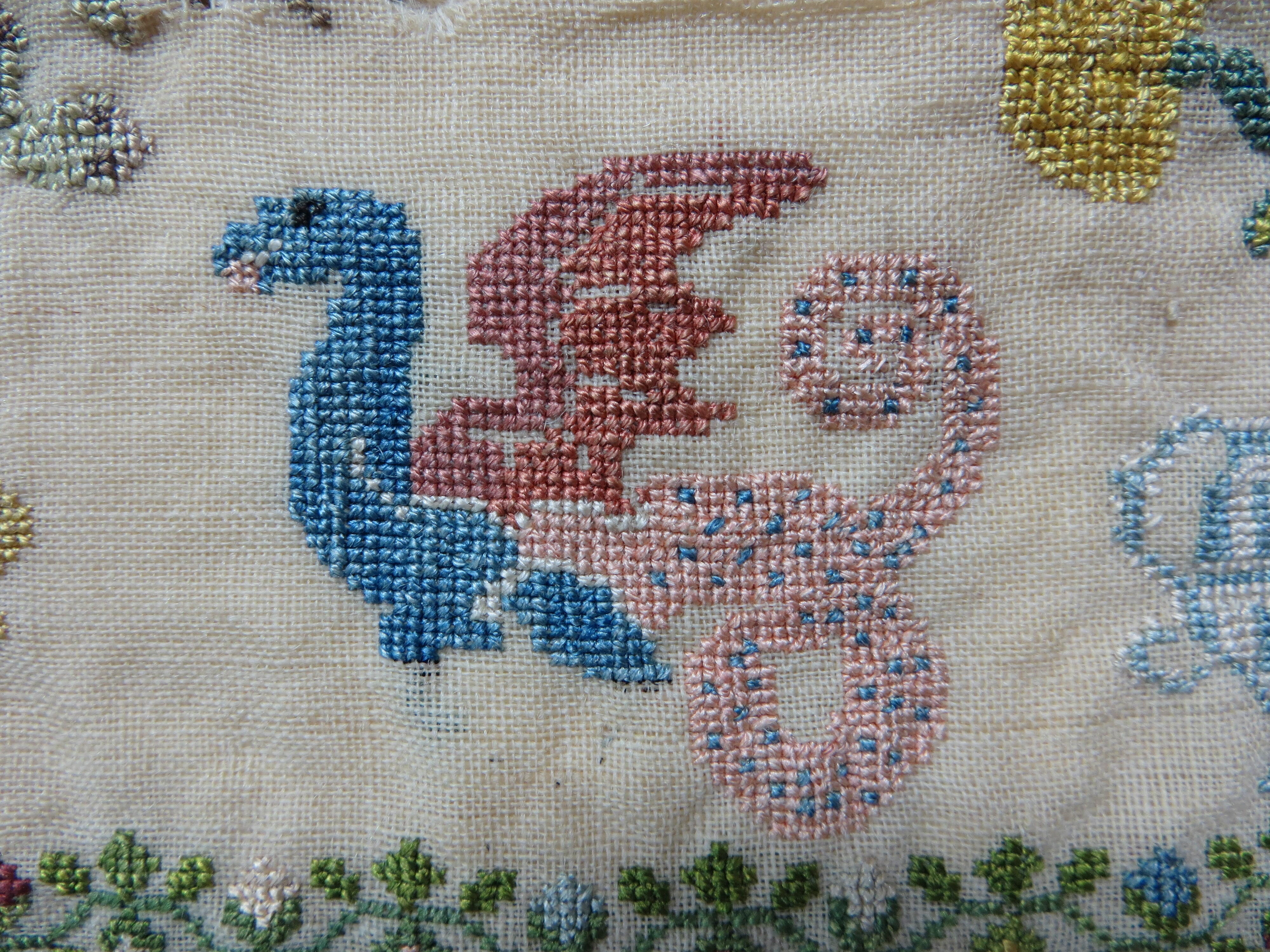 Detailfoto borduurlap met draak