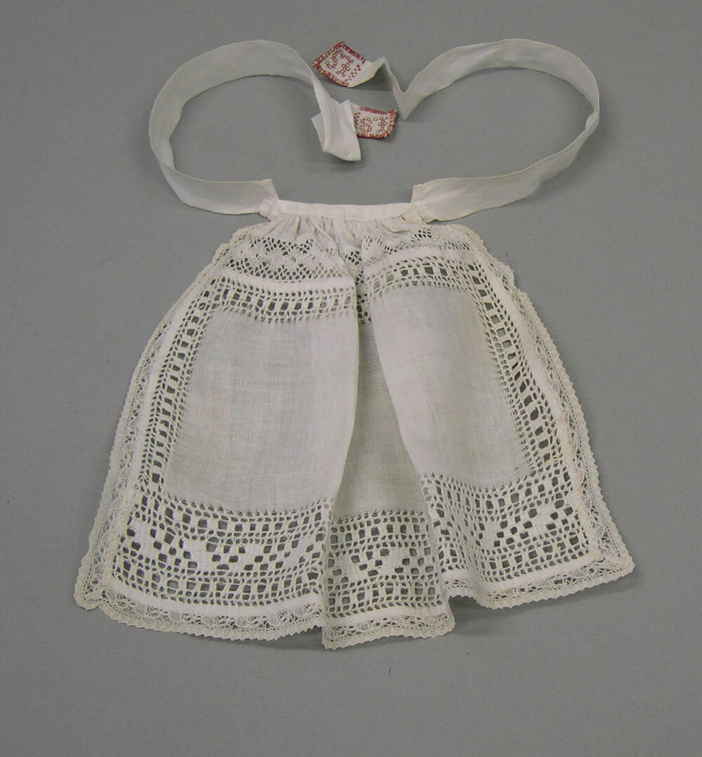Poppenkleding (schort)