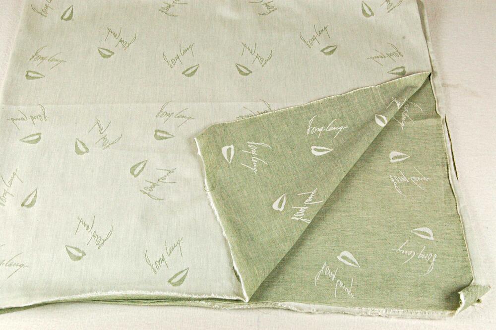 Staal kledingstof 'Fong Leng', in groen-wit