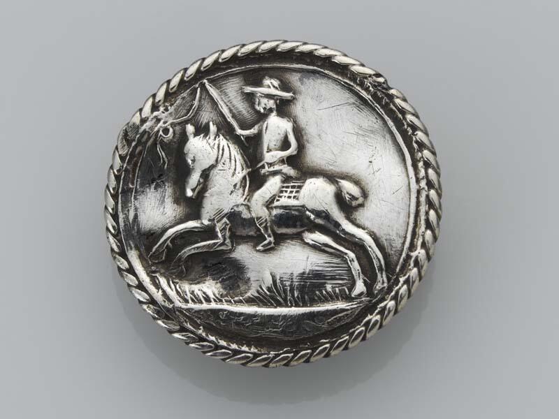 Platte, ronde knoop met een ruiter te paard