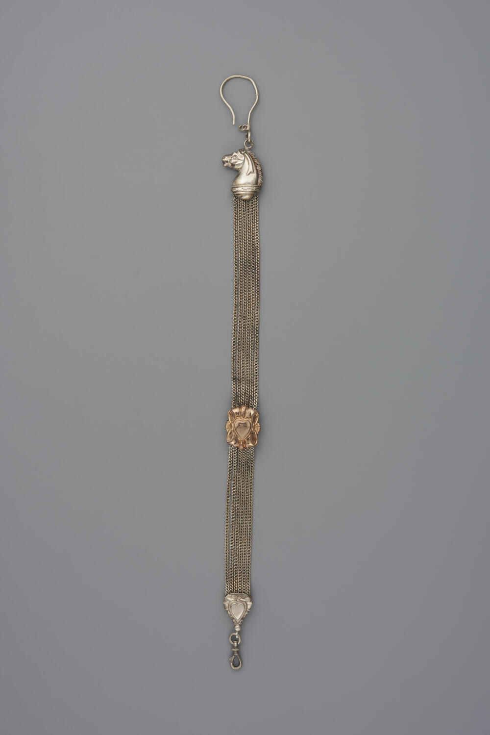 Horlogeketting met paardenkop en schuifje, circa 1898