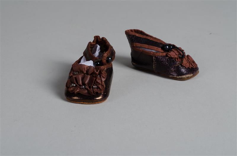 Paar poppenschoenen