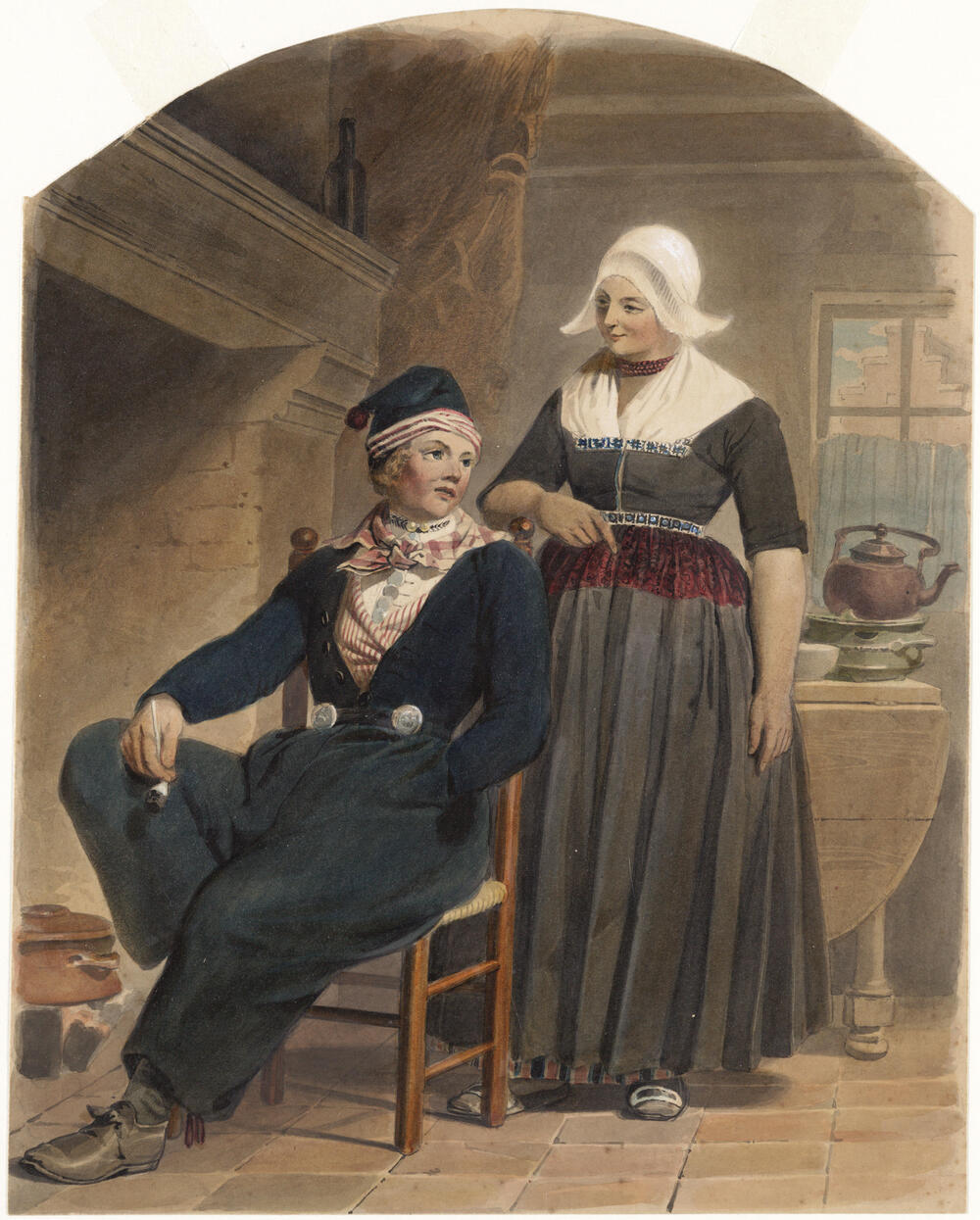 Man en vrouw, gekleed in de dracht van Volendam, in een interieur