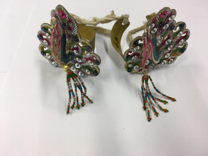 Armband (paar) met dierfiguur.