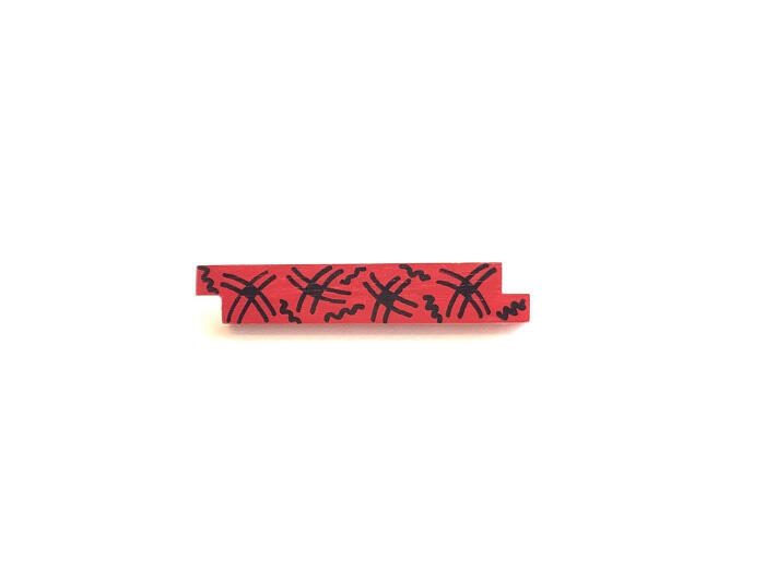 Staafjesbroche met zwarte figuren