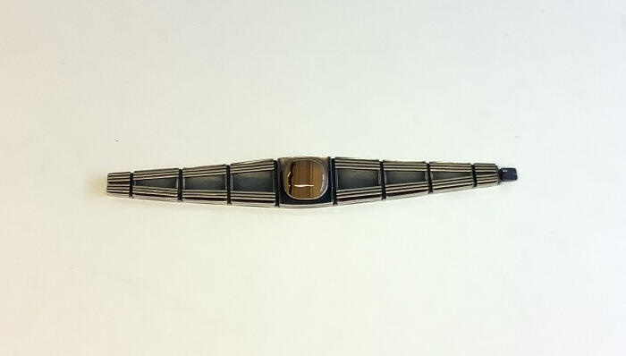Armband met gouden spijltjes en streepagaat