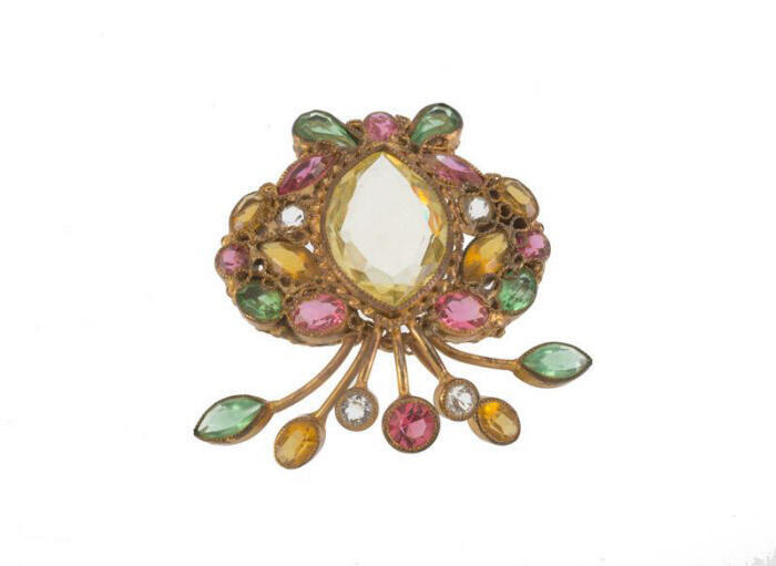 Goudkleurige broche met stenen