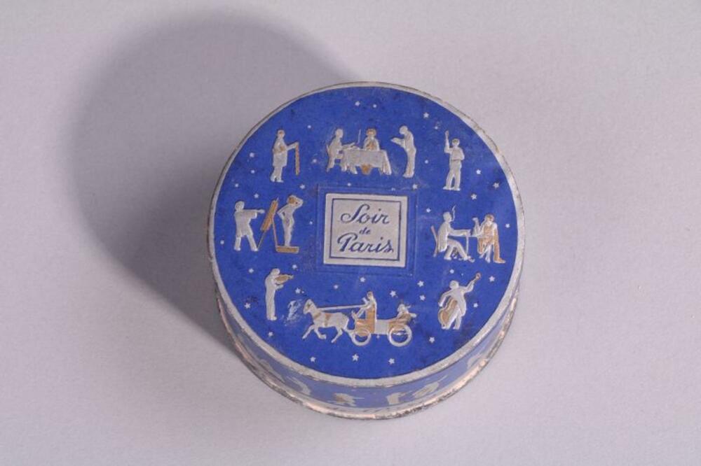 Blauwe poederdoos in karton met figuren in zilver- en goudkleuren