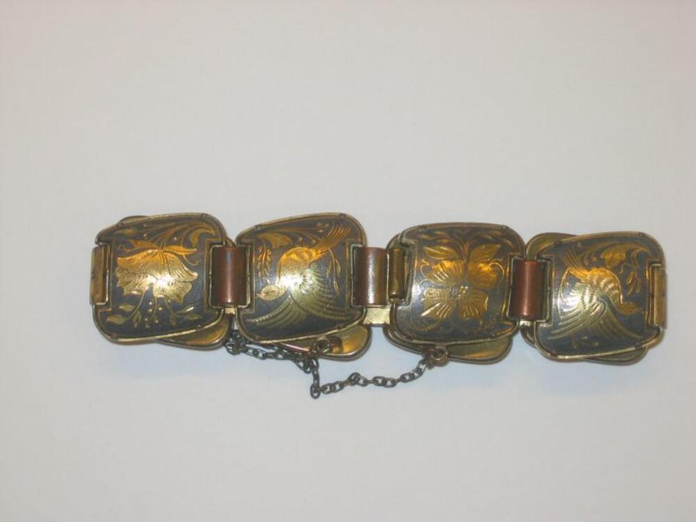 Armband in metaal met bedrukking van goudkleurige bloemen en vogels