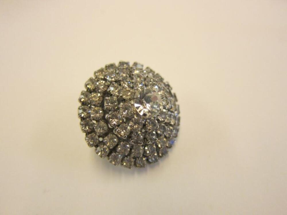 Broche in wit metaal met stras