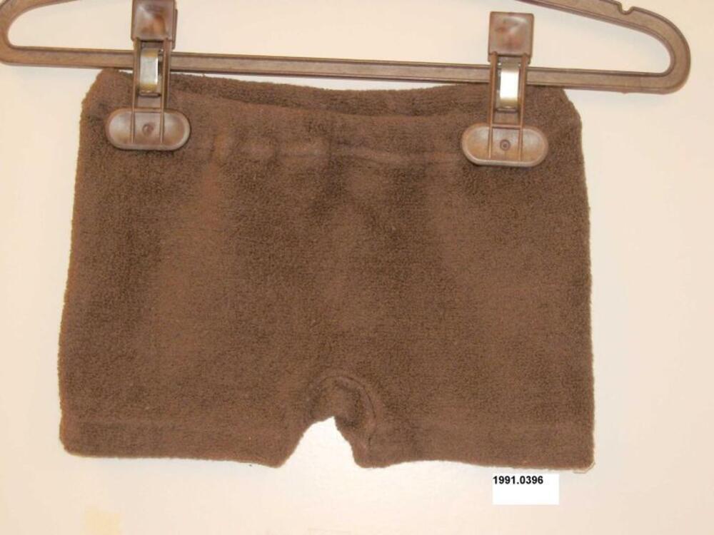 Broek in bruine badstof met een schildpad applicatie op het achterpand