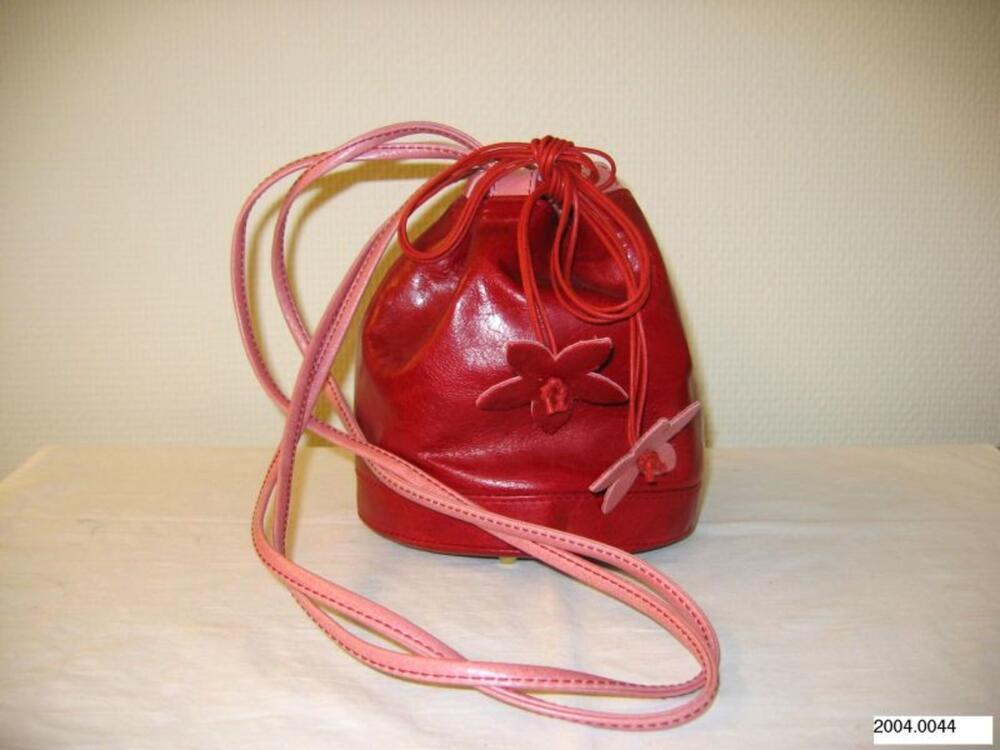 Ronde tas in rood leer met roze accenten