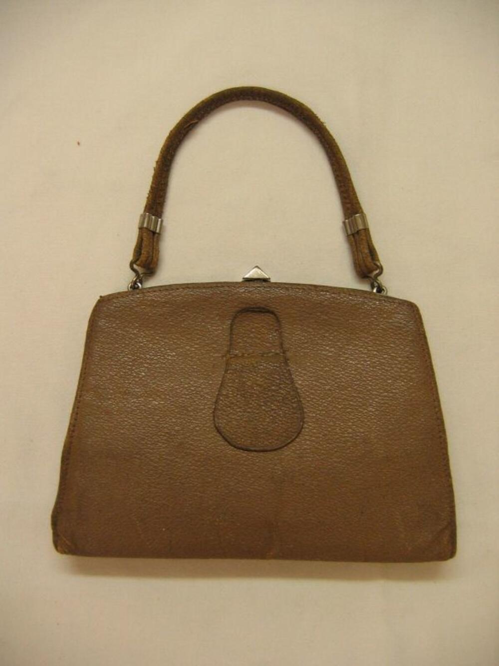 Handtas in okerbruin leer