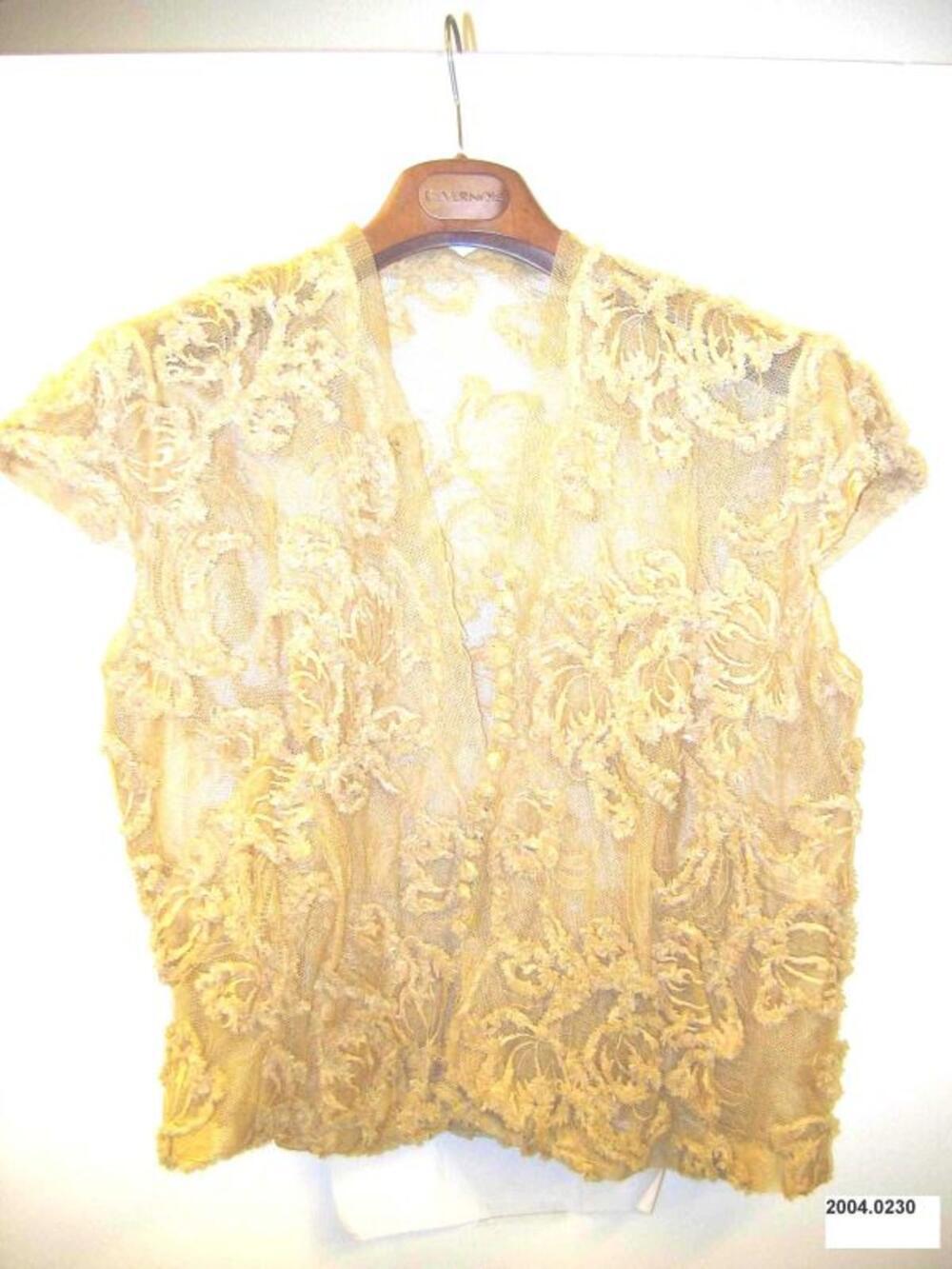Blouse in beige tule met raffia