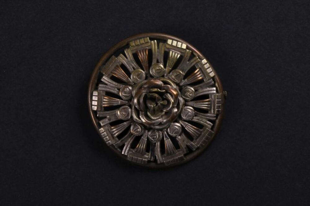 Ronde broche in koper