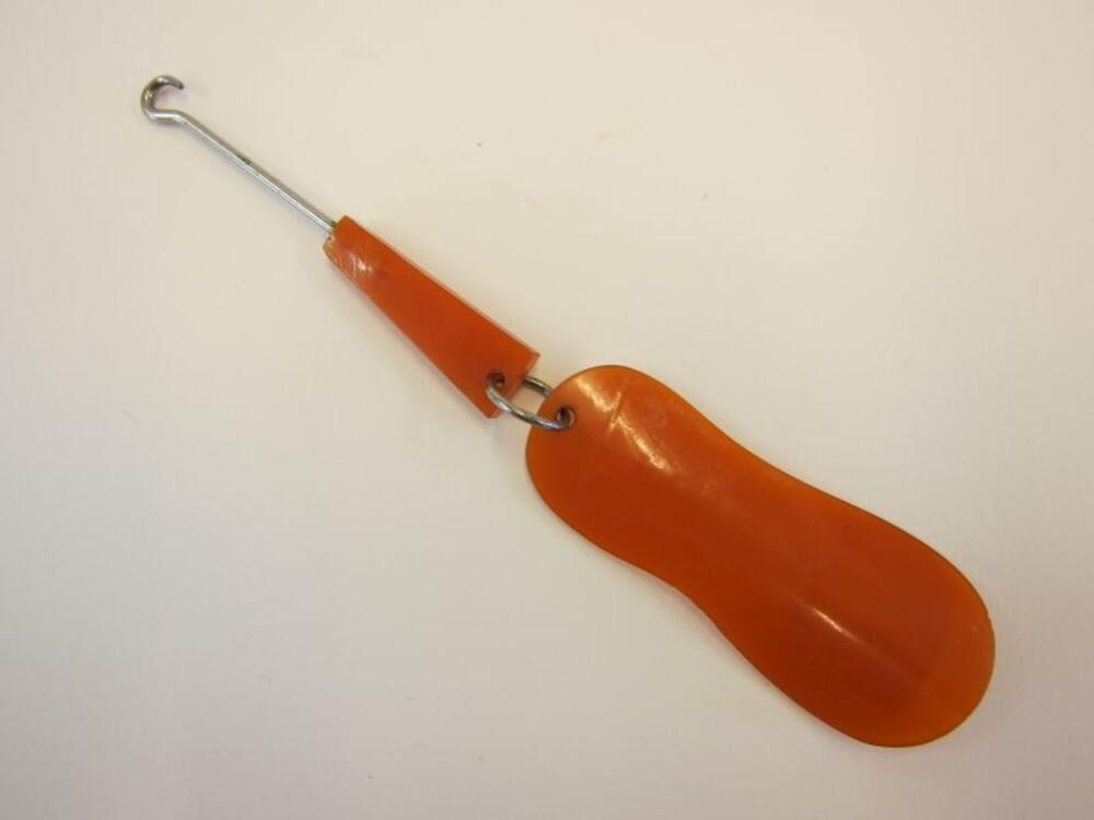 Schoenlepel in oranje celluloid