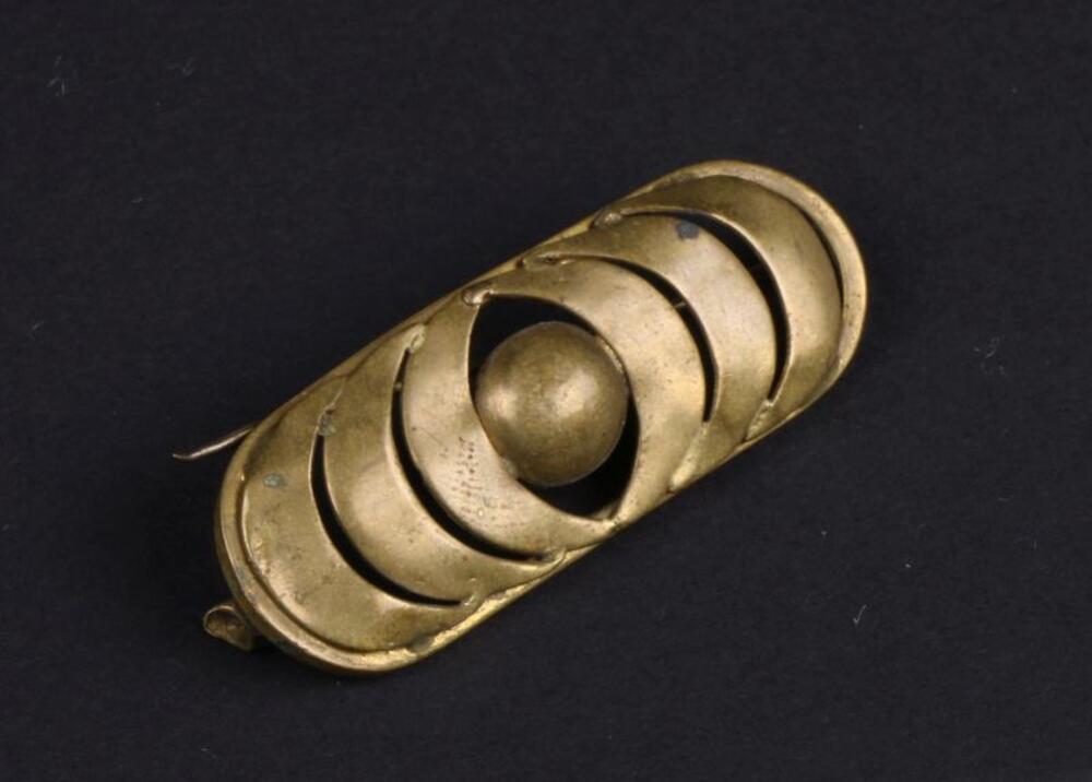 Kleine broche in koper