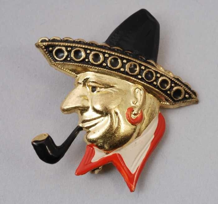 Broche, kop van een Mexicaan, geverfd goudkleurig metaal, kapper Van Vliet