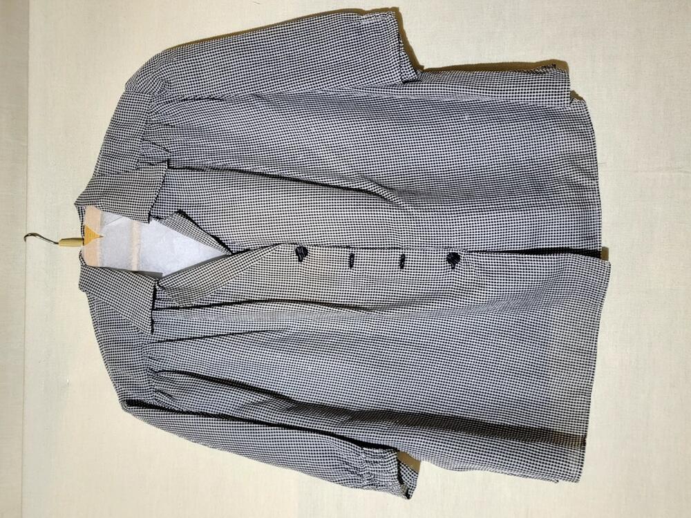 Blouse van zwart/wit geruit cloquénylon