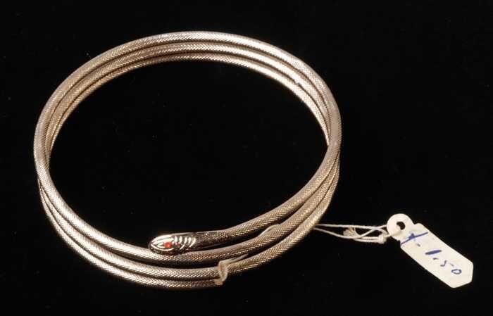 Armband, spiraalarmband in de vorm van een slang, van koperkleurig metaal met drie windingen,…