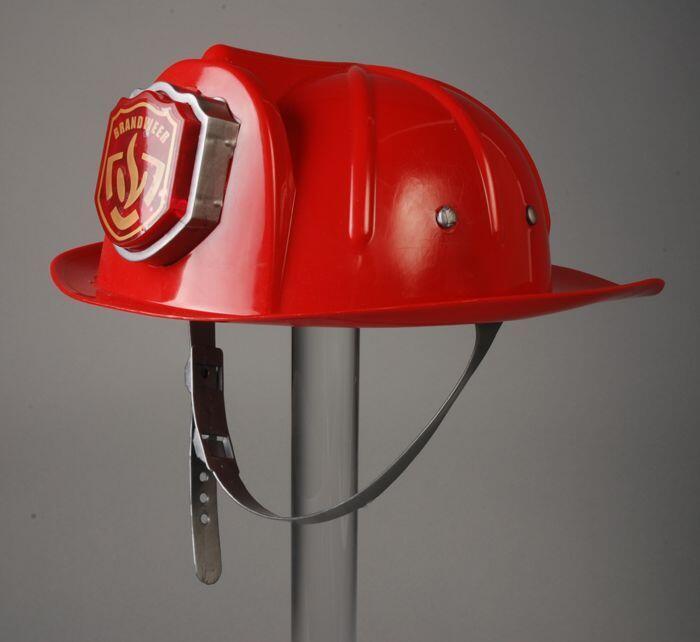 Rode helm van zwart kinder-brandweerpak