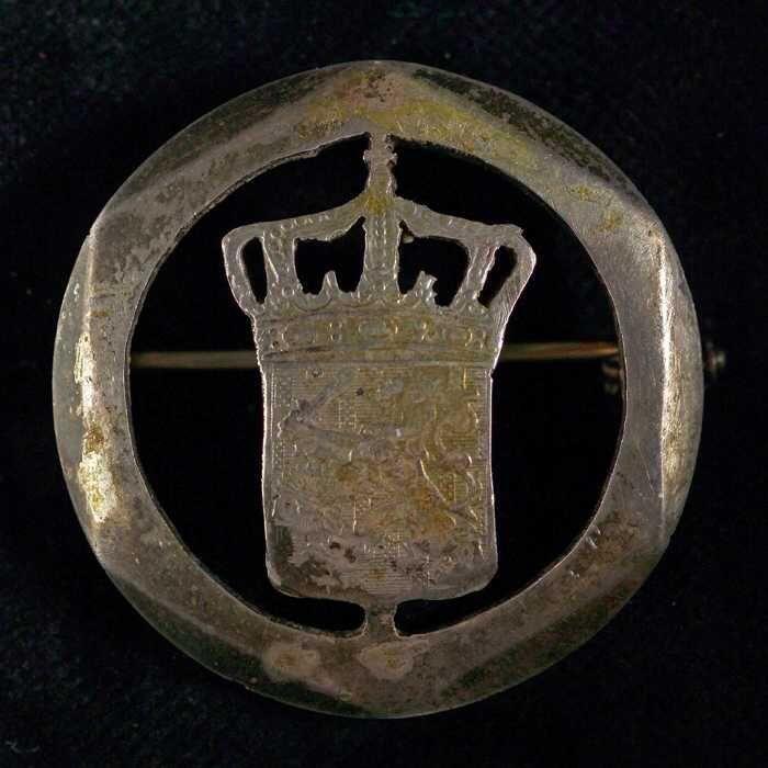 Broche uit uitgezaagde rijksdaalder