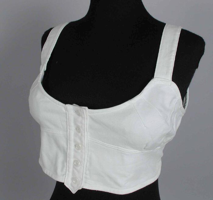Witte flanellen bustehouder, vrij kleine cups, groot rugpand, knoopsluiting voorzijde brede…