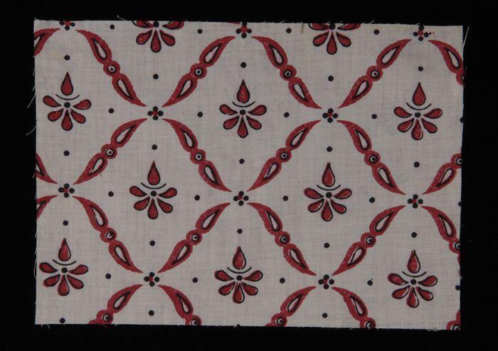 Stofstaal, katoen met door ornamenten gevormd ruitpatroon in rood en zwart, Kralingse…
