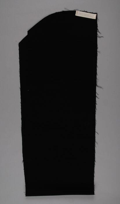 Stofstaal van zwart keper voor uniformen voor suppoosten Historisch Museum, 1957