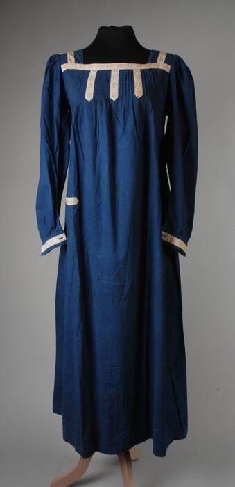 Blauw mouwschort met witte, gedecoreerde band