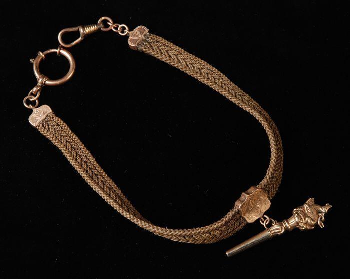 Band voor zakhorloge van gevlochten mensenhaar met gouden sluiting