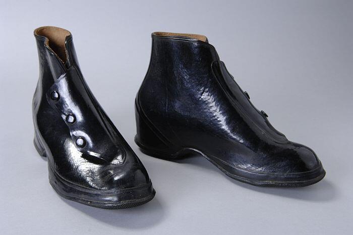 Zwarte rubbern enkelhoge overschoenen met drie drukknopen, voor damesschoenen