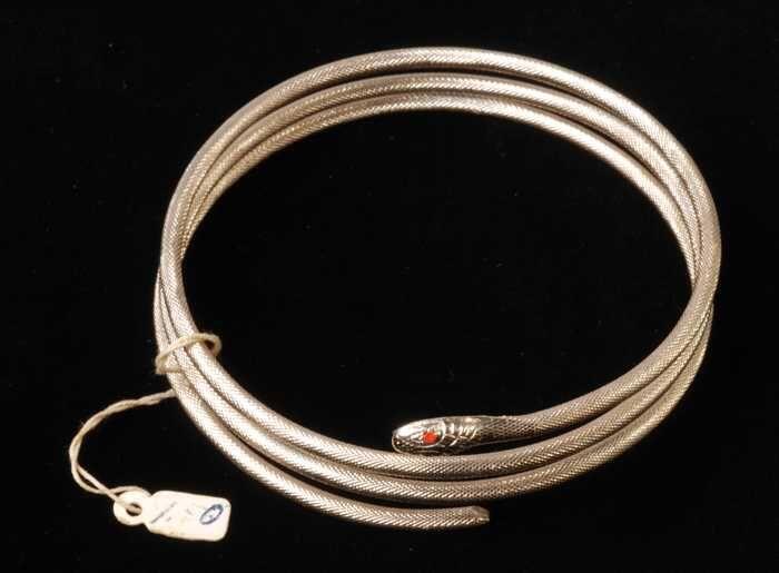 Armband, spiraalarmband in de vorm van een slang, van koperkleurig metaal met drie windingen,…