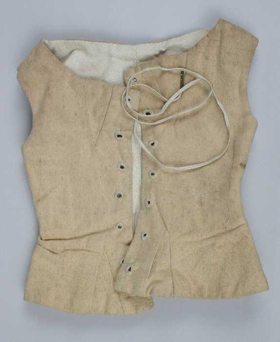 Getailleerd poppenkorset of keurslijf van ongebleekt katoenen beige keper, met veter voor