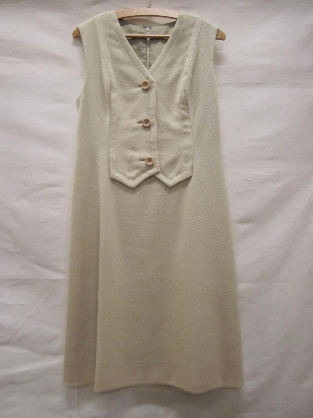 Jasje van beige gemengde wol in keperbinding, met reverskraag en rond geknipte voorpanden,…
