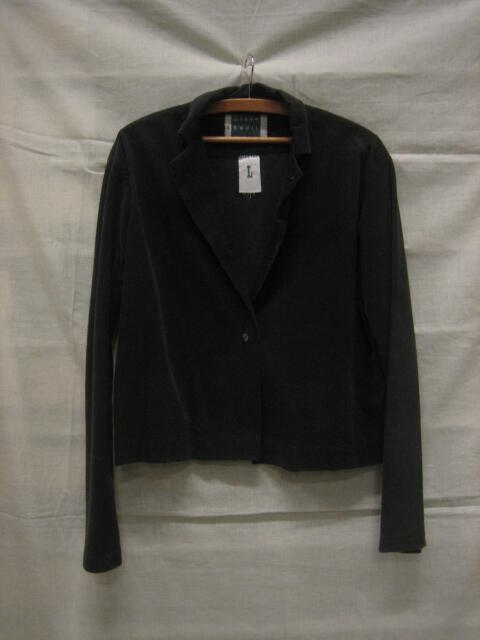 Blouse van zeer donkergroen ribfluweel met lange mouw, wijd model