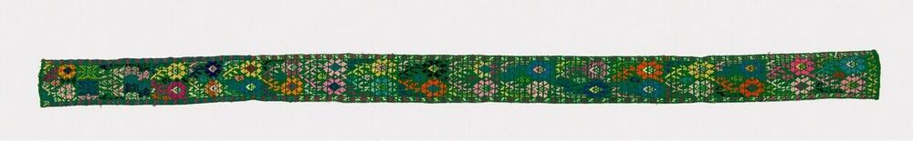 Groene haarband met bloemmotief