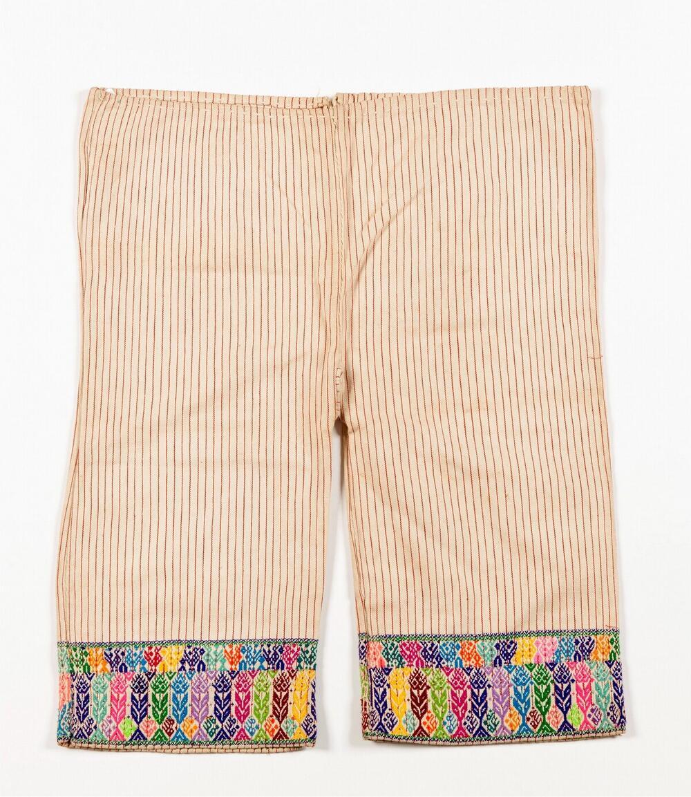 Witte broek met vogel- en plantmotieven