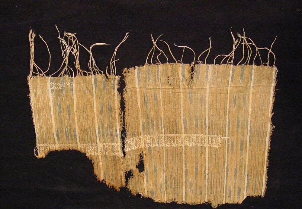 Katoenen weefselfragment met Kufisch schrift