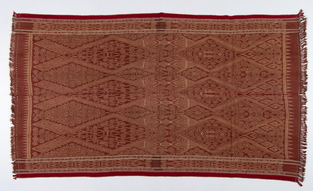Katoenen doek met patroon van gestyleerde mensfiguren in schering ikat