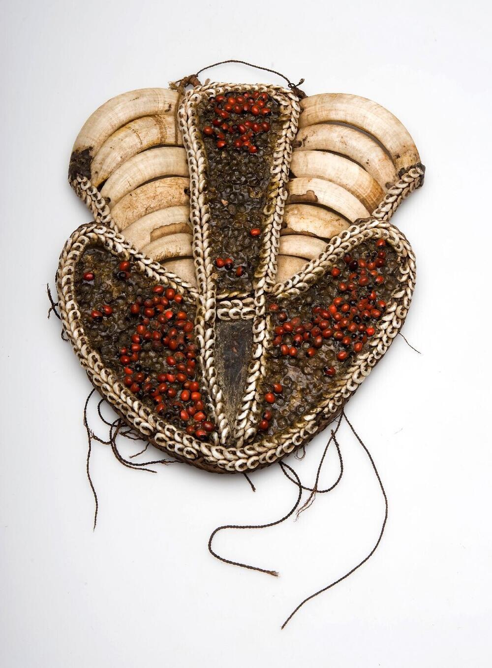 Chest ornament with seeds, shells and tusks