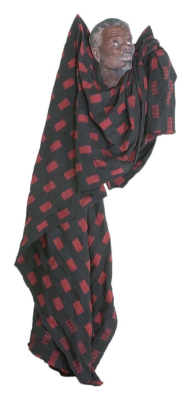 Katoenen kentedoek met blokmotief, gedragen als begrafeniskleding