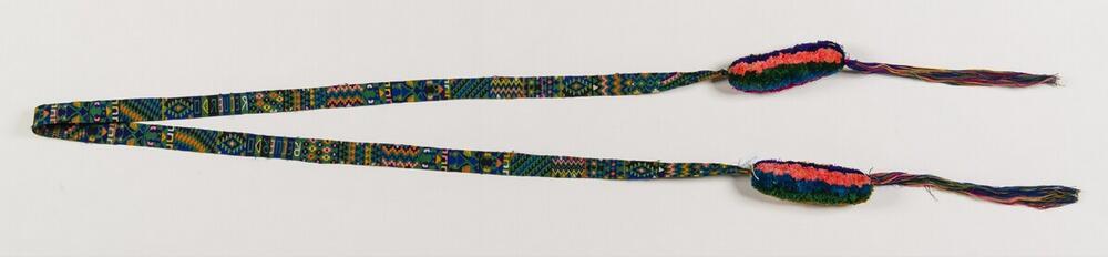 Groen-blauwe haarband met geometrische motieven