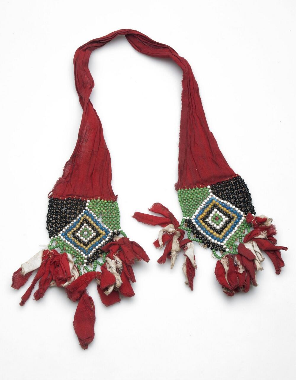 Belt from red cotton, decorated with beadwork