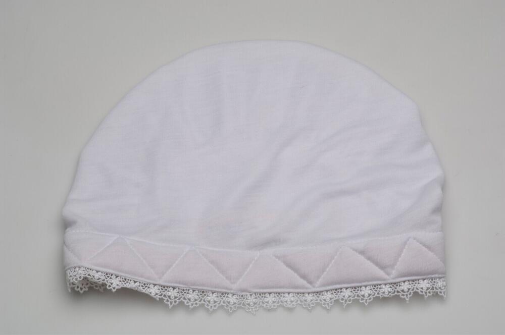 Cap, part of a costume for a Muslim woman who has made the pilgrimage to Mecca