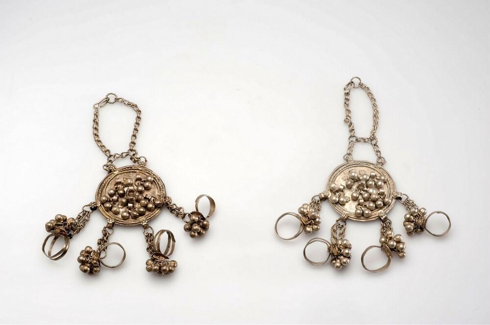 Silver hand decorations with rings, decorated with bells