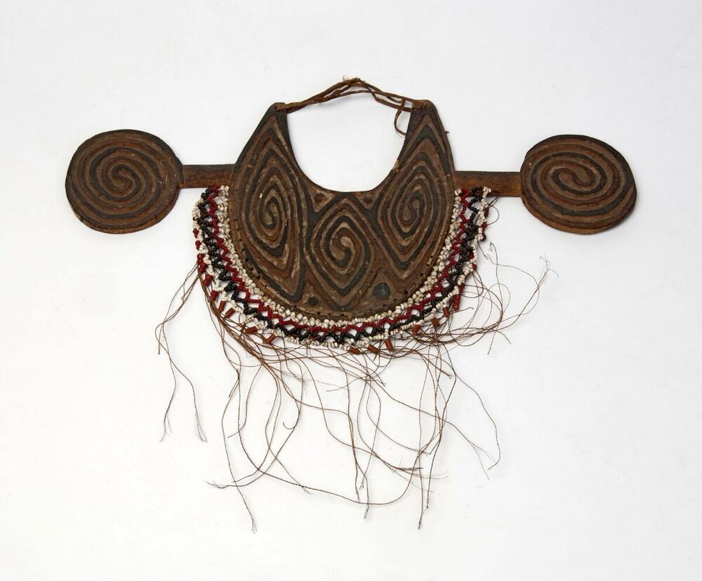 Man's breast ornament made of wood