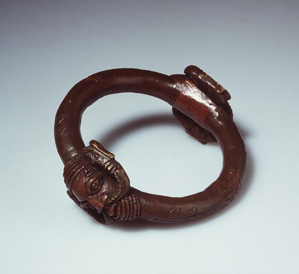 Arm ring with two human heads