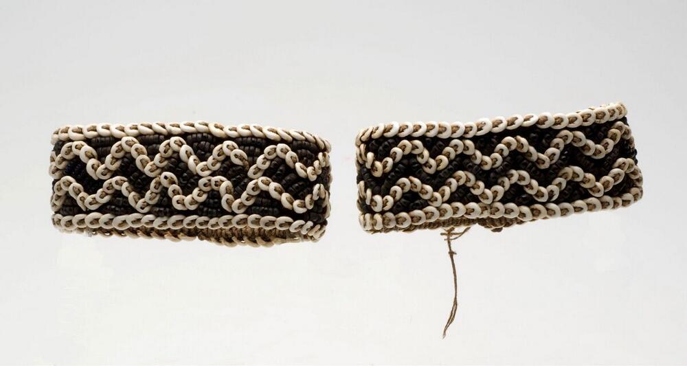 Bracelets for the upper arm, worn by a man