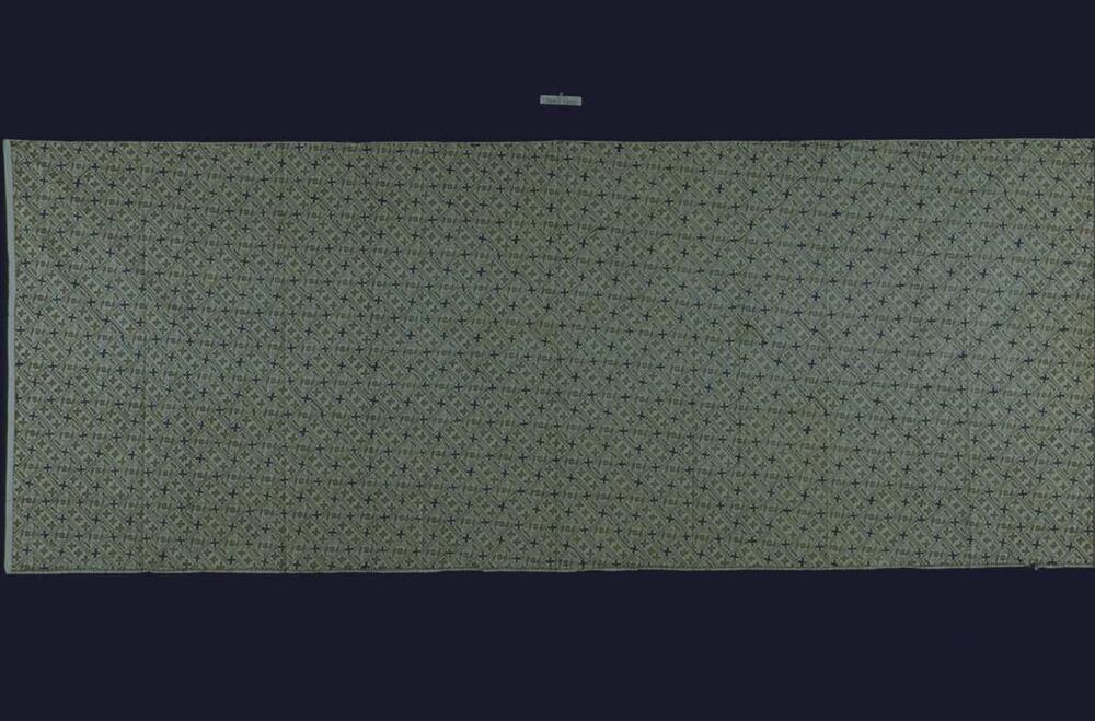 Wikkelrok met geometrisch patroon van swastika-motieven